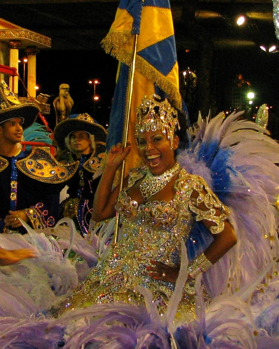 a lady in a costume on parade with other women