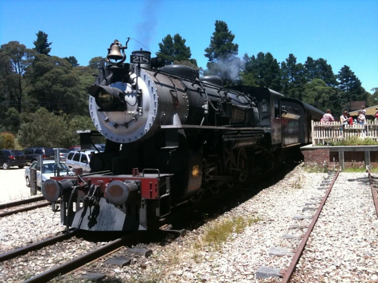 an old steam locomotive in motion on a track