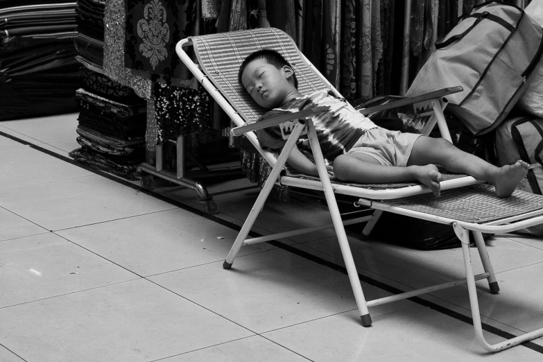 a child in a chair sleeping in a room