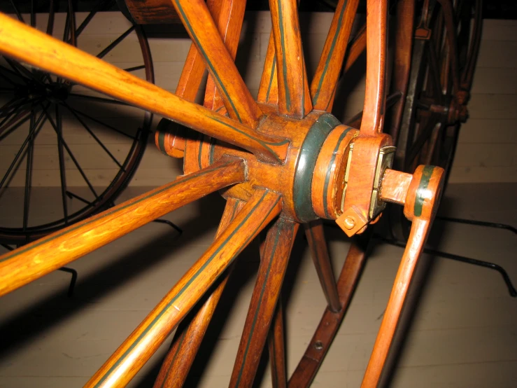 a view of an orange wooden spokes in a wagon