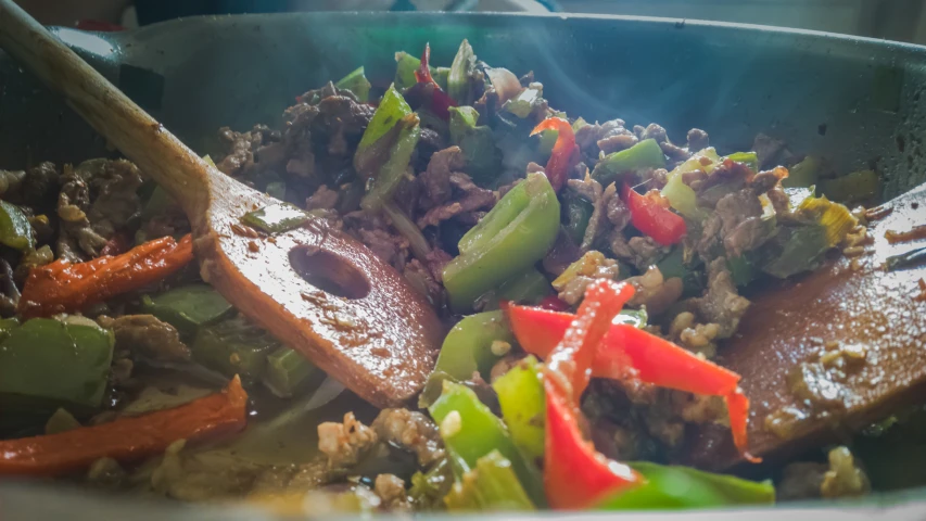 a colorful salad with carrots, peppers and green beans