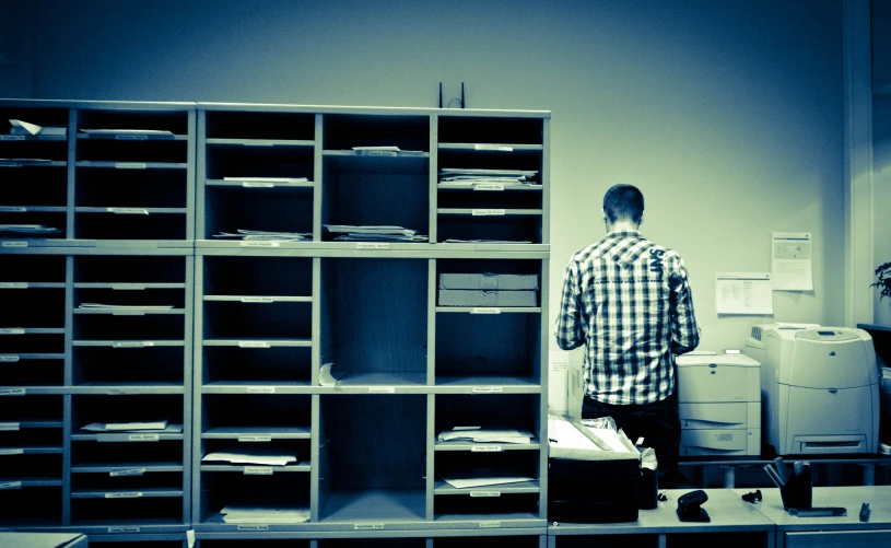a person stands near the office desk