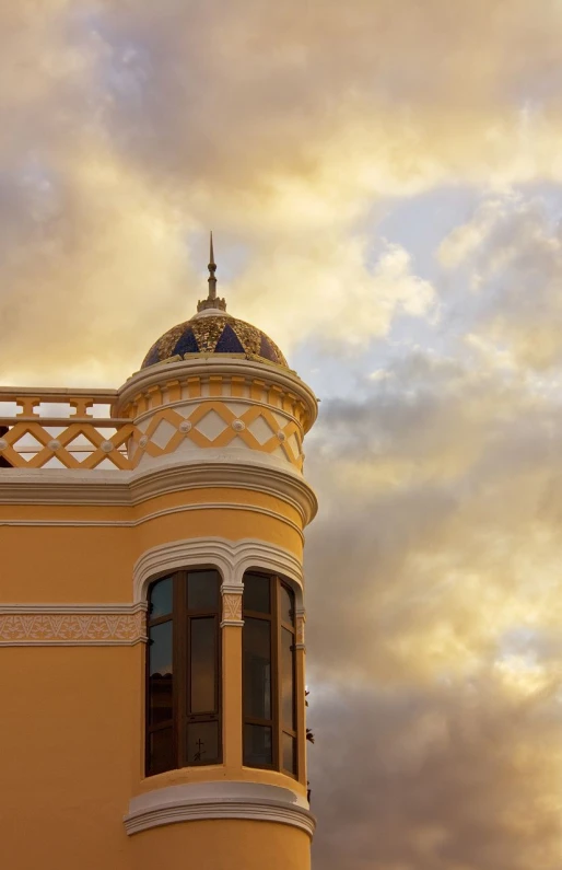 a building with a gold domed clock on the side