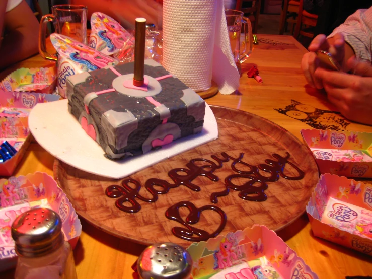 a happy 50th birthday cake sits on top of a table