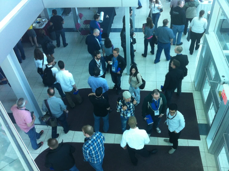 crowd of people in a lobby waiting for the show