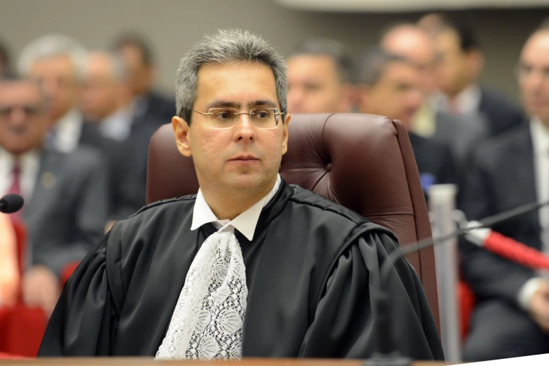 a man in a judge's robes in the process of getting appointed