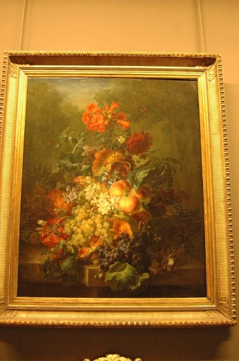 a painting in an ornate gold frame