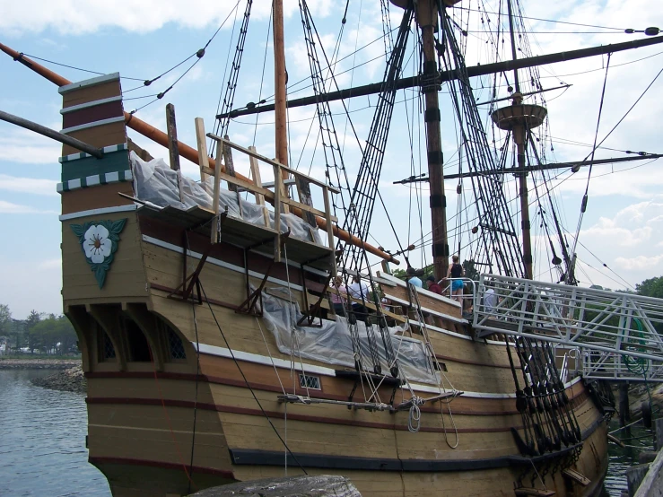 an old model of a sail ship in a harbor