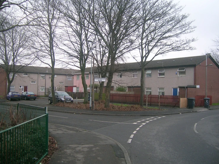 a street corner with a street sign in the foreground