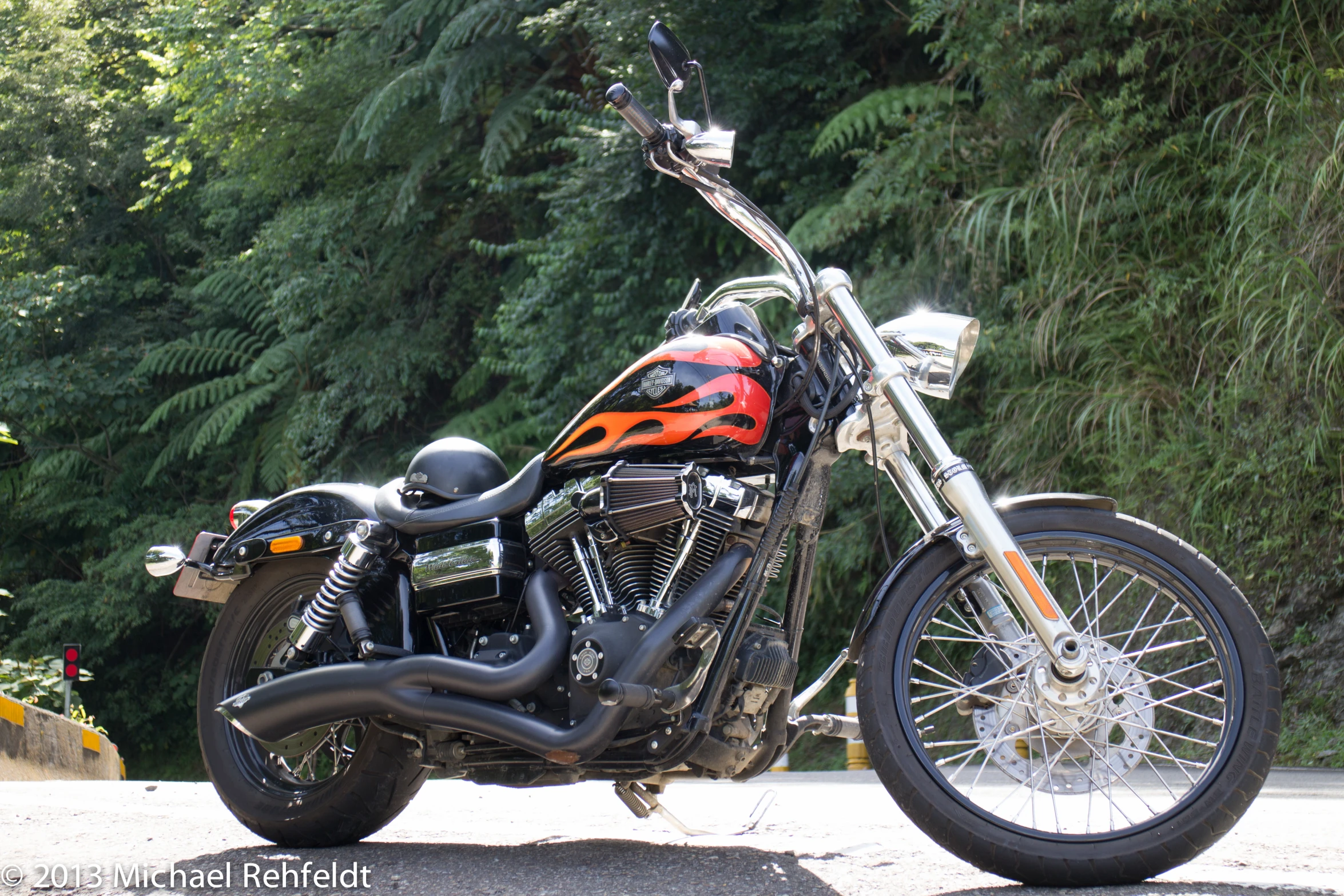 a harley davidson motorcycle parked on the side of a street