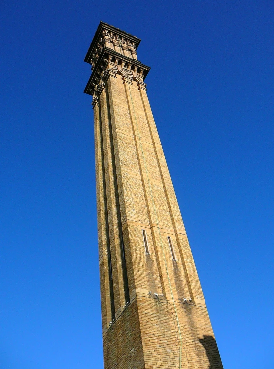 a tall clock tower against the blue sky