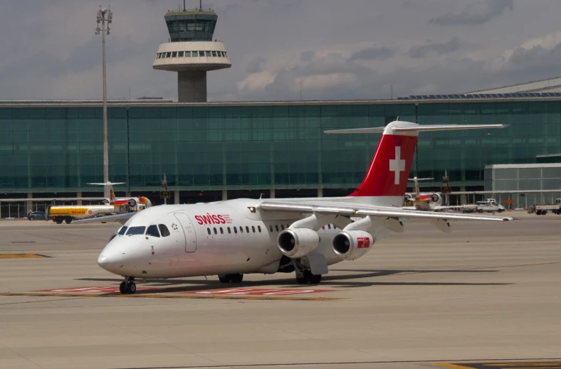 an airplane sitting on the tarmac at an airport