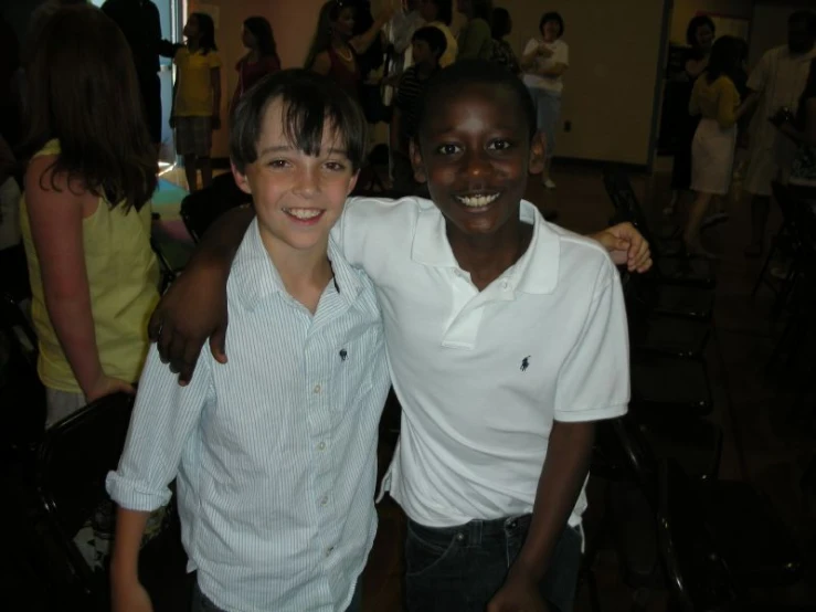 two smiling young men standing side by side