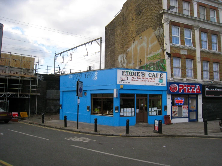 the blue corner restaurant in the corner of a city street