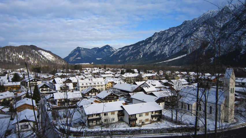 a very snowy town surrounded by mountains and snow