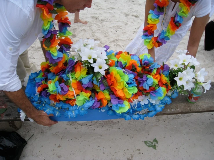 a couple of men with flower decorations on them