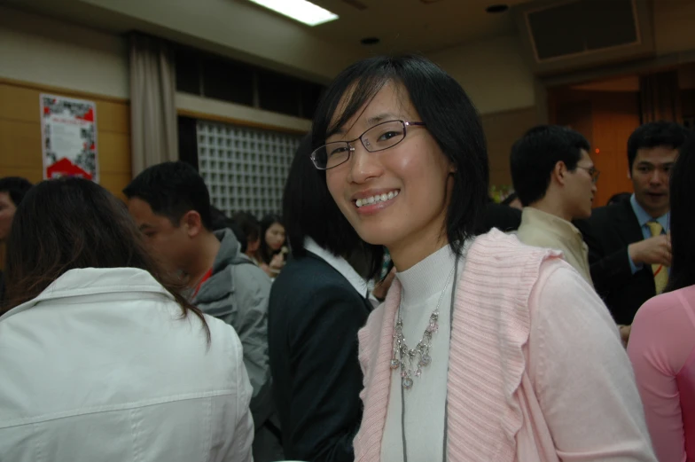 a woman posing for a po in a crowded place