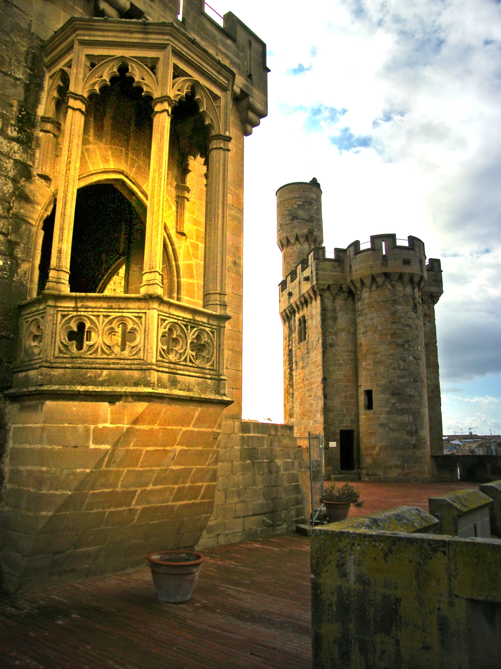 an old castle with a balcony and tower