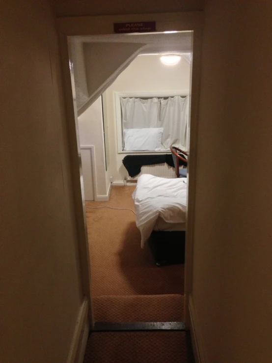 an open door leads to a bedroom