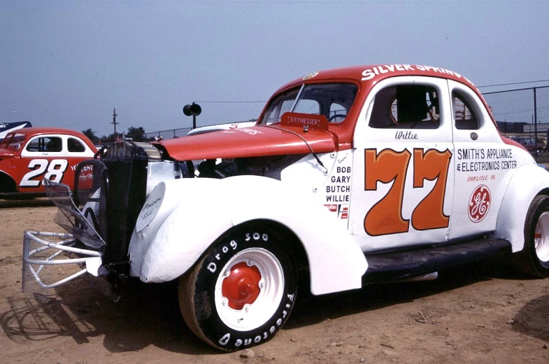 an old - fashioned car with the number 21 on it's side