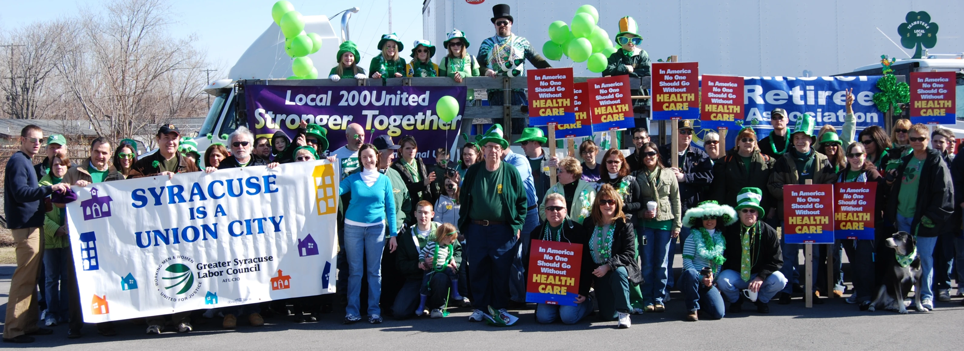 many people are holding signs on the street