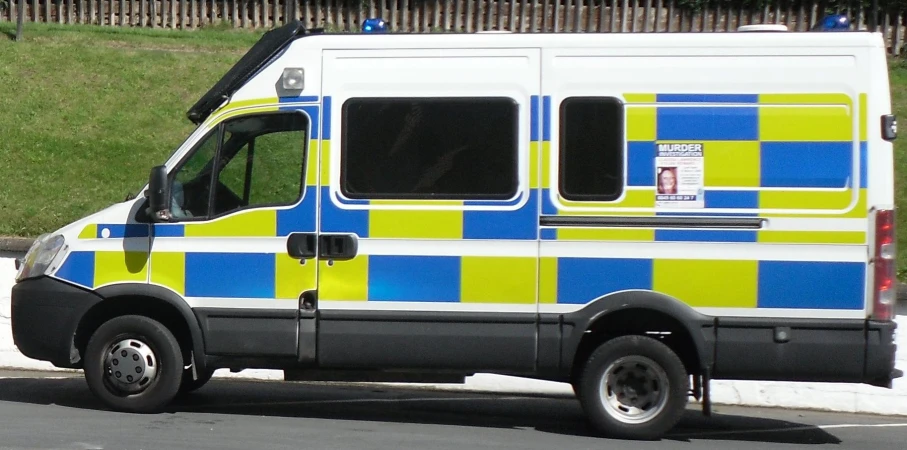 a large van that has blue and yellow stripes on it