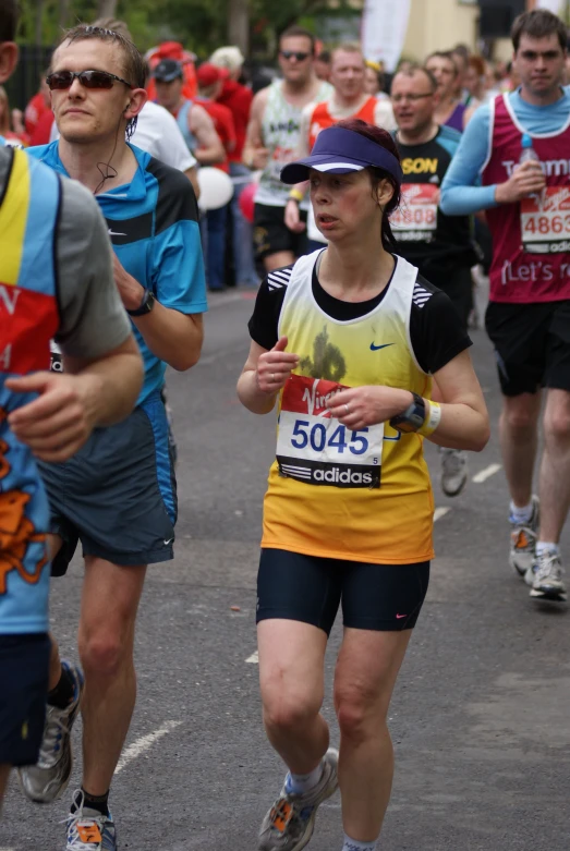 there are many runners on the street running together