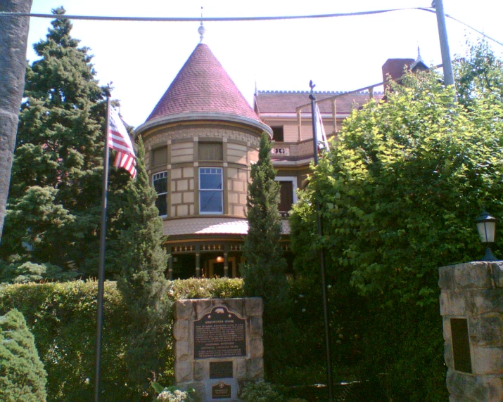 a house with a flag pole on the front