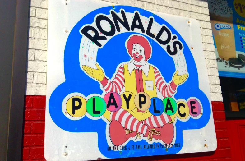 ronald's play place sign on the side of a building