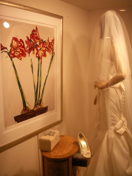 a woman in a white wedding dress, with flowers in her veil