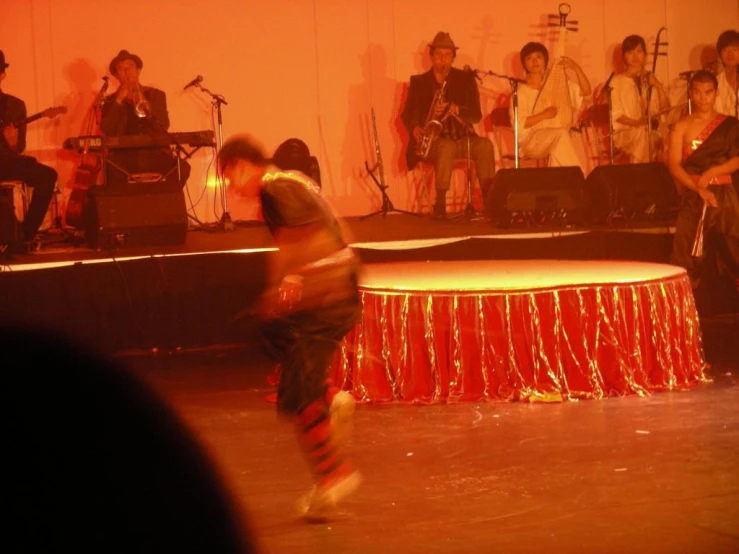 a man on a stage in front of a group of people