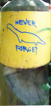 a yellow box with writing and a dolphin painted on it