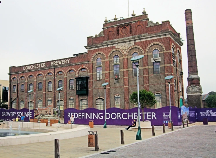 a large red brick building with a sign that says roberting dorsmeister