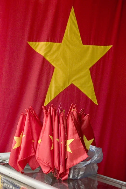 red folded flags with yellow stars on a chinese flag