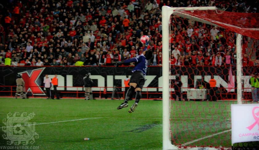 man is in the air after jumping into the ball