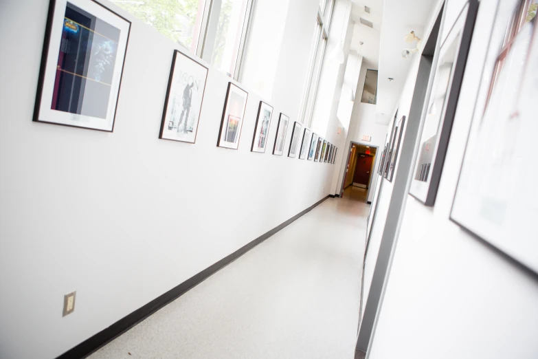 some framed pictures are on a wall near a doorway