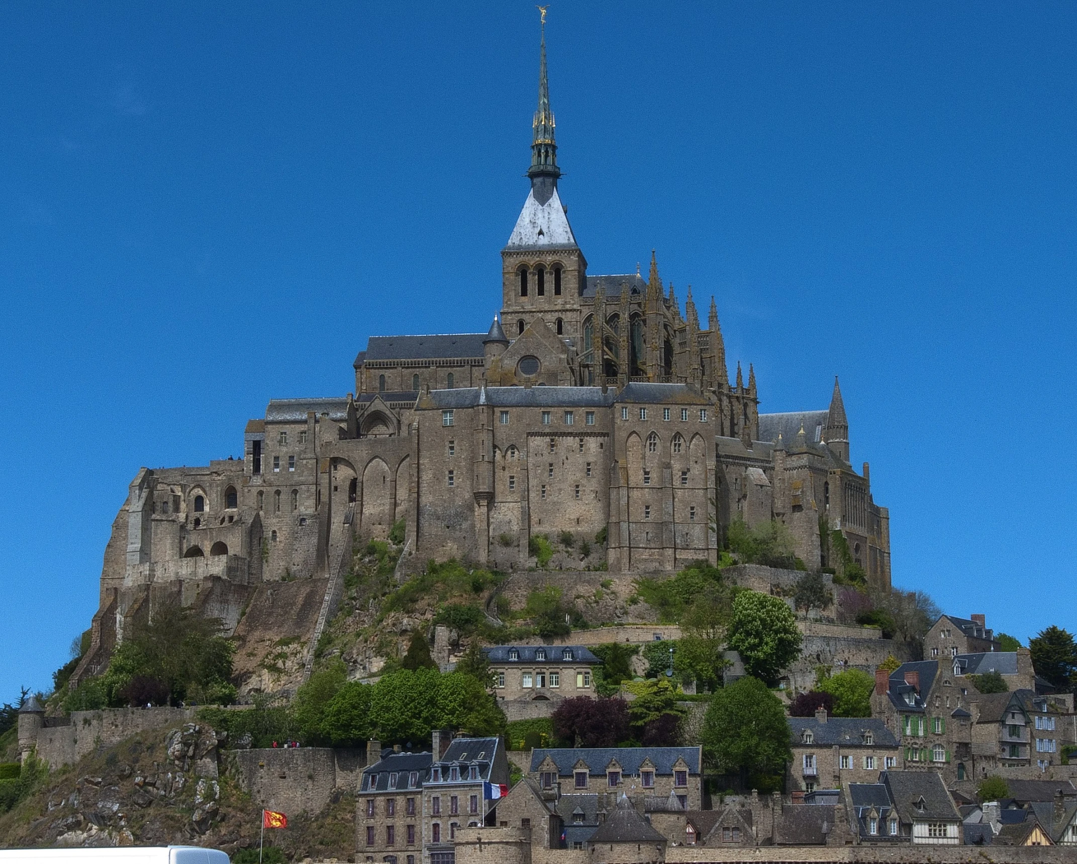 a very tall building on top of a hill