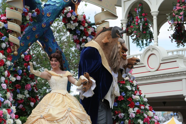 two people in princess costumes and a person dressed as a bear