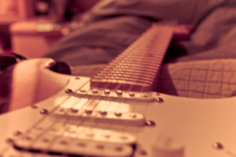 the head and body of a guitar being used