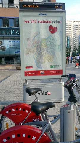 the bicycle is parked in front of the map
