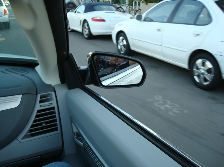 a side view mirror on the front of a car