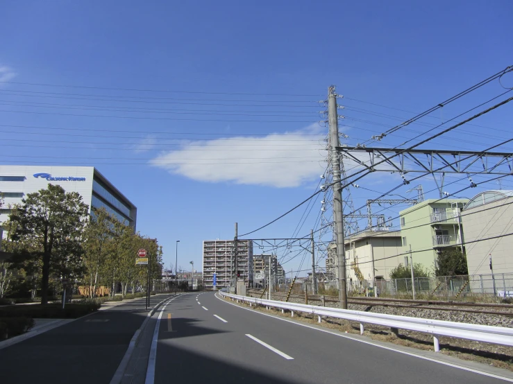 an empty road surrounded by buildings on both sides