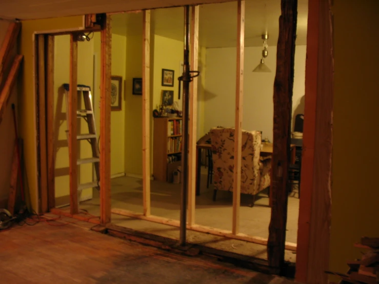 a room with a doorway and some insulation attached to the wall