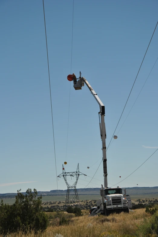 a utility truck is in the middle of a field