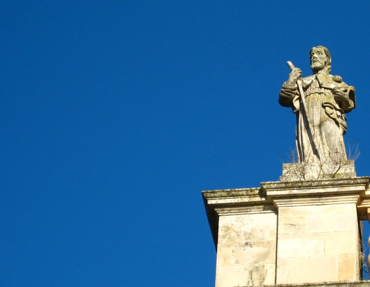 a statue of jesus is on top of the tower