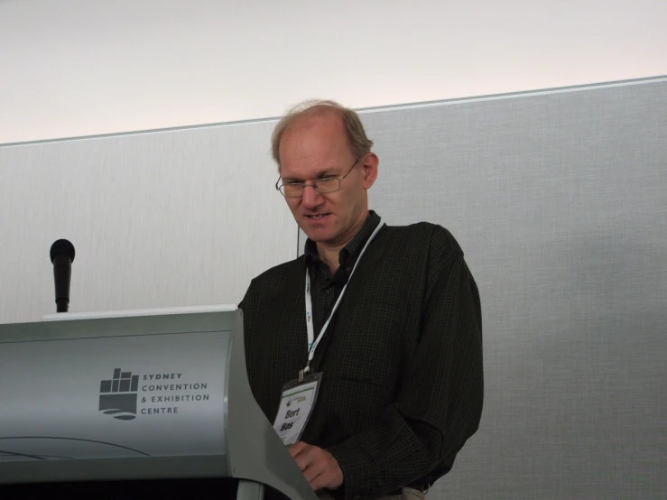 a man in an office setting giving a presentation