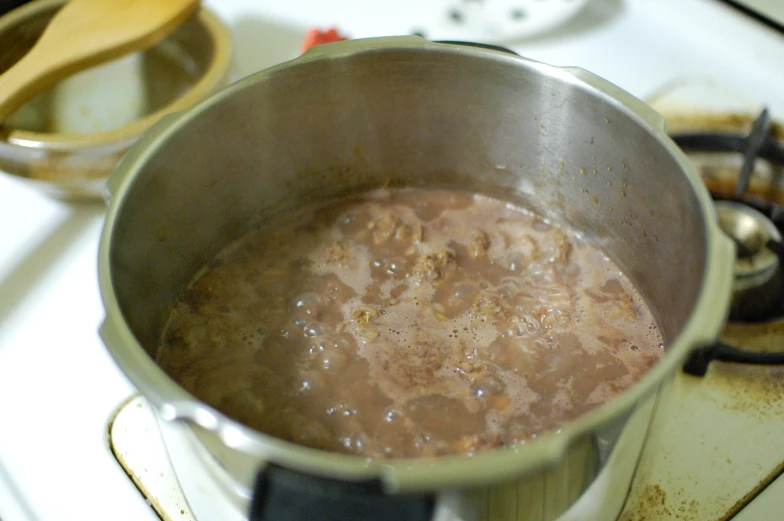 a pot on the stove filled with boiling
