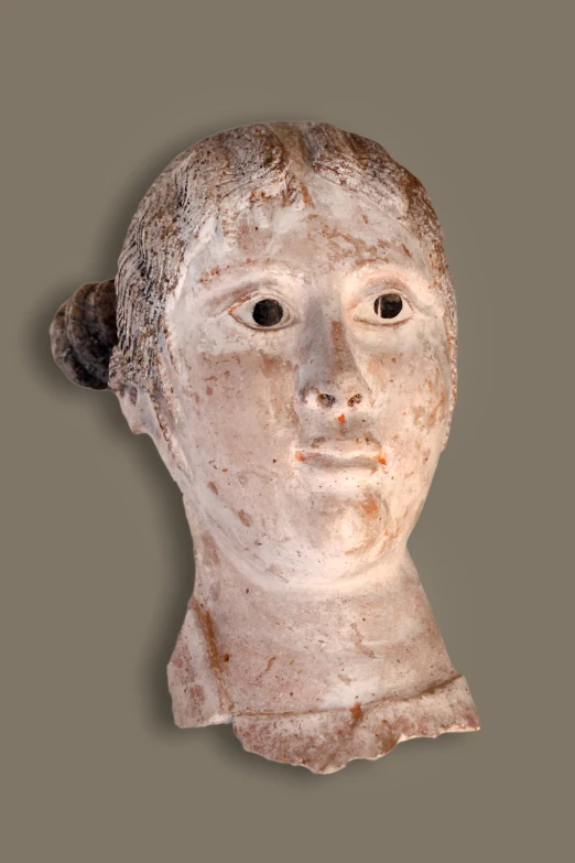 an old white busturine head, looking down at the viewer