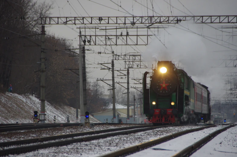 a train that is traveling down the tracks