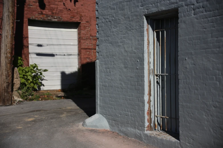 a white door is at the top of a gray building